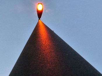 Low angle view of illuminated built structure against sky