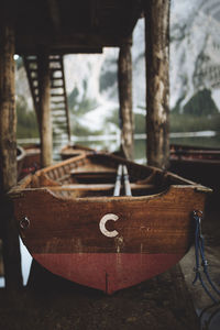 Close-up of boat moored at lakeshore