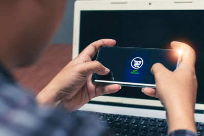 Close-up of man using mobile phone