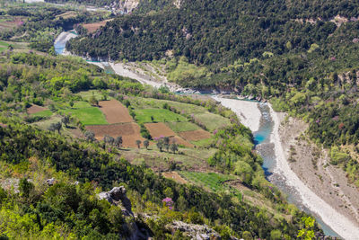 Scenic view of landscape by river