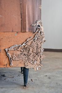 Man standing on wood against wall