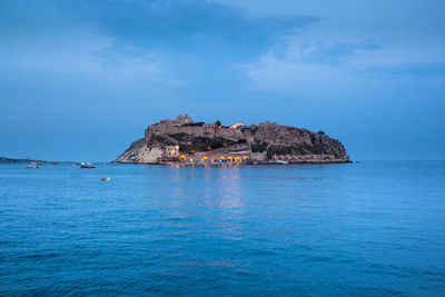 Scenic view of isole tremiti and sea against cloudy sky