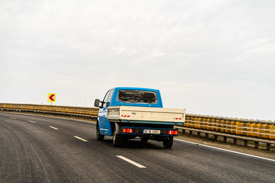 Car on highway against sky