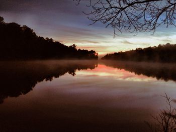 Reflection of trees in calm lake