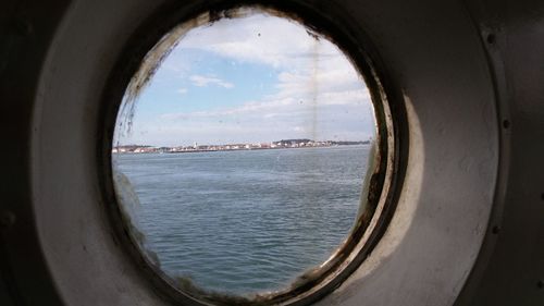 View of sea seen through window