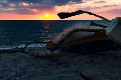 Scenic view of sea against sky at sunset