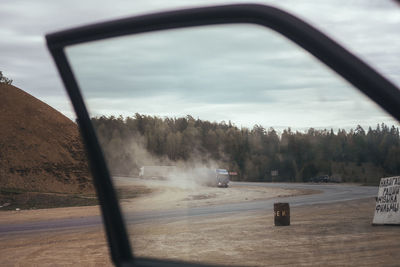 Scenic view of trees seen through car windshield
