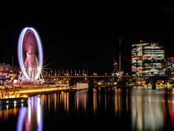 Extravagant lights of sydney darling harbour and its ferris wheel