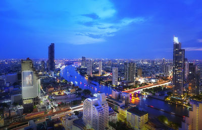 High angle view of illuminated buildings in city at night