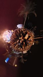 Illuminated christmas lights in city at night