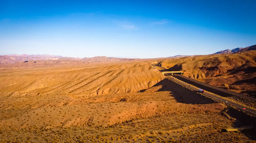 View of desert against blue sky