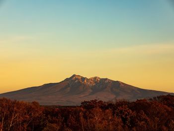 Scenic view of mountains against sky during sunset