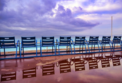 View of bridge over sea against cloudy sky