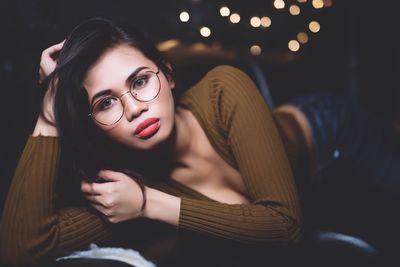 Portrait of young woman lying down