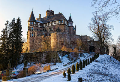 Historic building against sky during winter