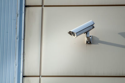 Close-up of security camera on wall