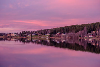 Scenic view of lake against romantic sky at sunset