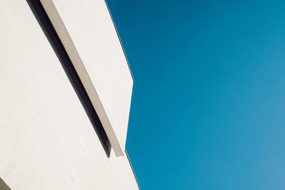 Low angle view of building against clear blue sky