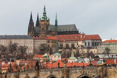 View of old buildings in town against sky