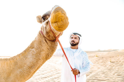 Full length of young man in desert