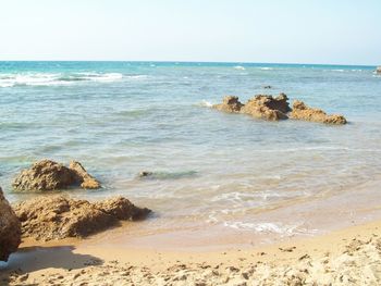 Scenic view of beach against sky