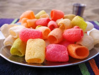 Close-up of colorful fried fryums in plate