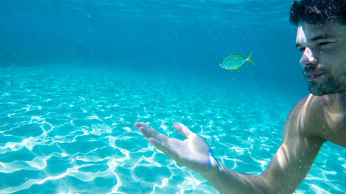 Man swimming in sea