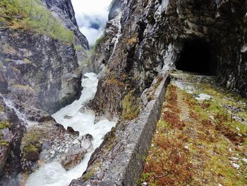 Scenic view of waterfall against sky