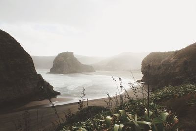 Scenic view of bay against sky