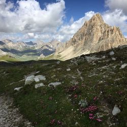 Scenic view of mountains against cloudy sky