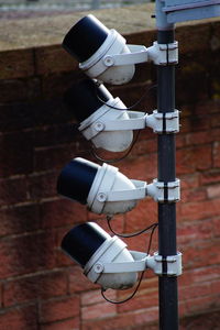 Close-up of electric lamp against wall