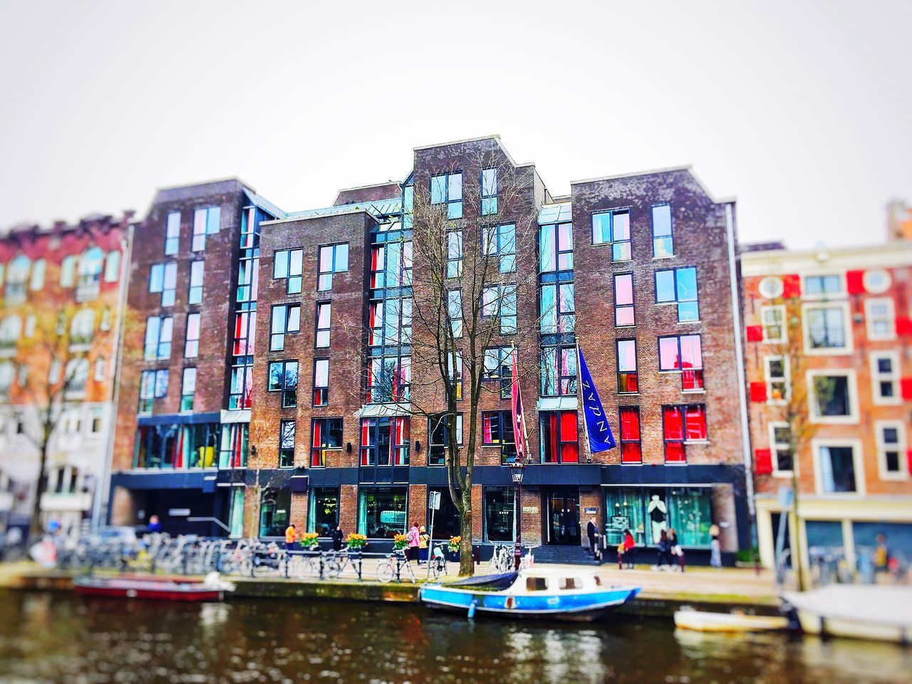 BOATS IN CANAL AGAINST BUILDINGS