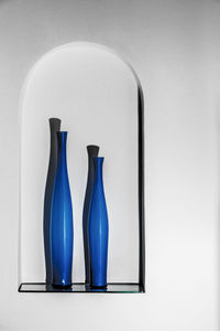 Close-up of blue over white background