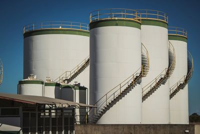 Low angle view of factory against sky