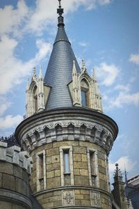 Low angle view of cathedral against cloudy sky