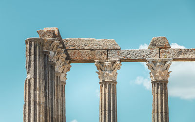 Low angle view of old ruin against blue sky