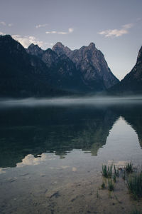 Scenic view of lake and mountains against sky