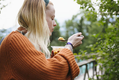 Woman eating outside