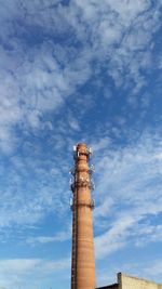 Low angle view of smoke stack against sky