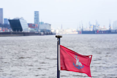 Red flag against elbe river