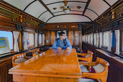 Man sitting on table in cruise