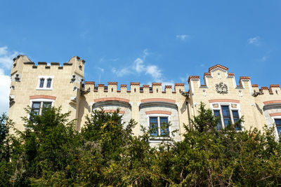 Low angle view of buildings against blue sky