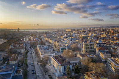 High angle shot of townscape against sky at sunset