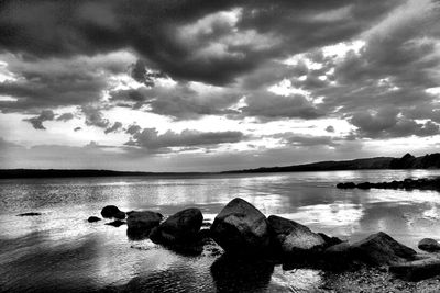 Scenic view of sea against cloudy sky