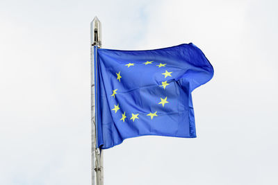 Low angle view of flag against sky