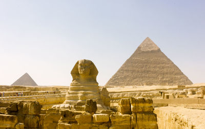 Statue of historic building against clear sky