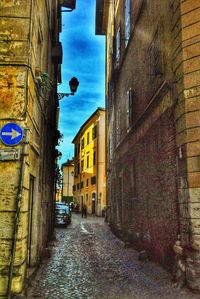 Alley amidst buildings in city