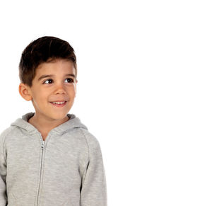 Portrait of smiling boy against white background