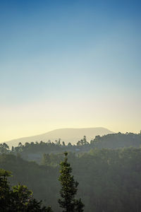 Scenic view of mountains against sky during sunset