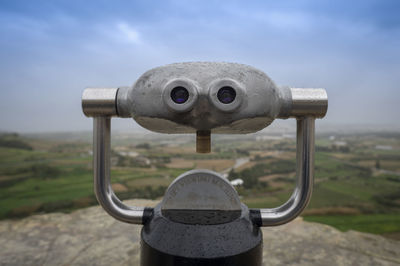 Metal binoculars at a viewing point, mdina, malta